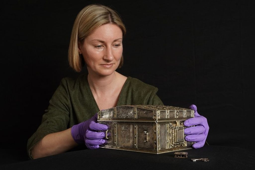 Woman holding casket