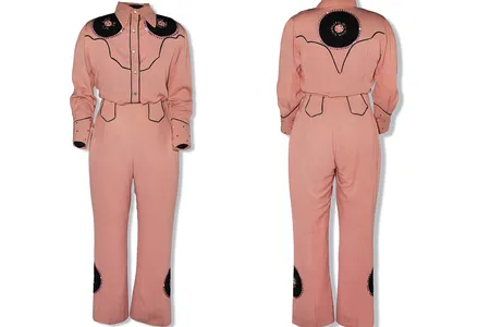 A western-style performance outfit worn by Patsy Cline and sewed by her mother. The suit features record-shaped patches stitched with the titles of some of Cline&#39;s records.


&nbsp;