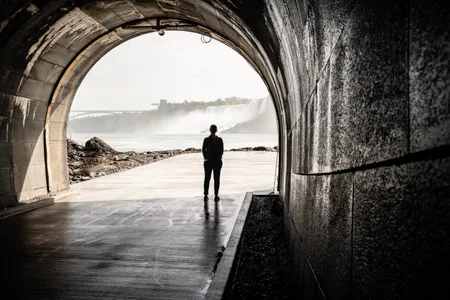 The tunnel opens onto an outdoor platform offering views of Horseshoe Falls.