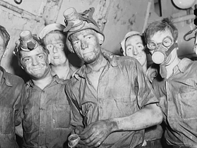 Merchant Mariners aboard a training ship working in the boiler room.