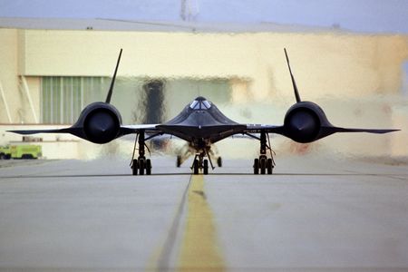An SR-71 taxis on the ramp.