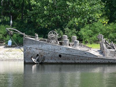 The large World War II barge that&rsquo;s now visible in the Po River