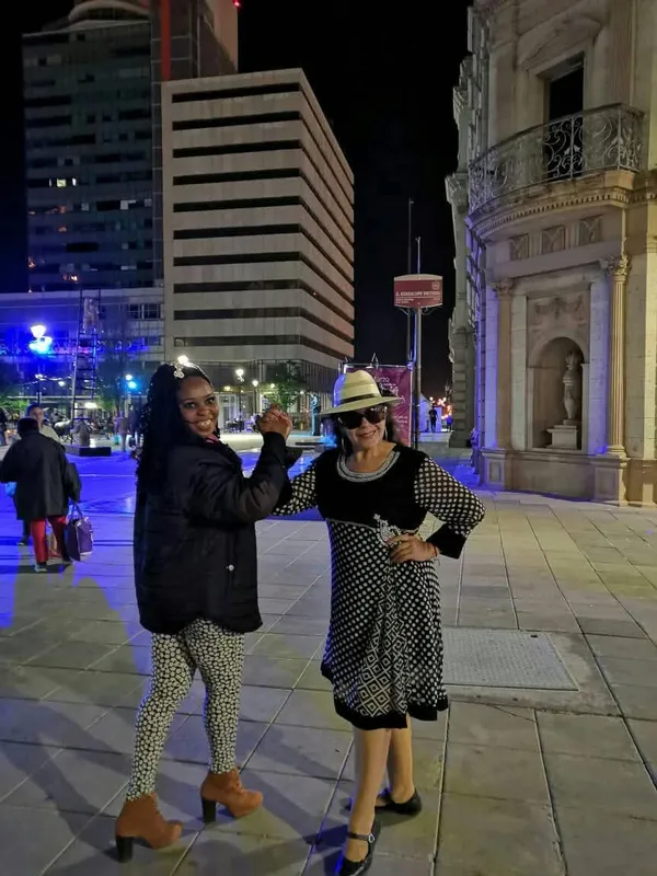 A vibrant nighttime photo captured at downtown plaza. thumbnail