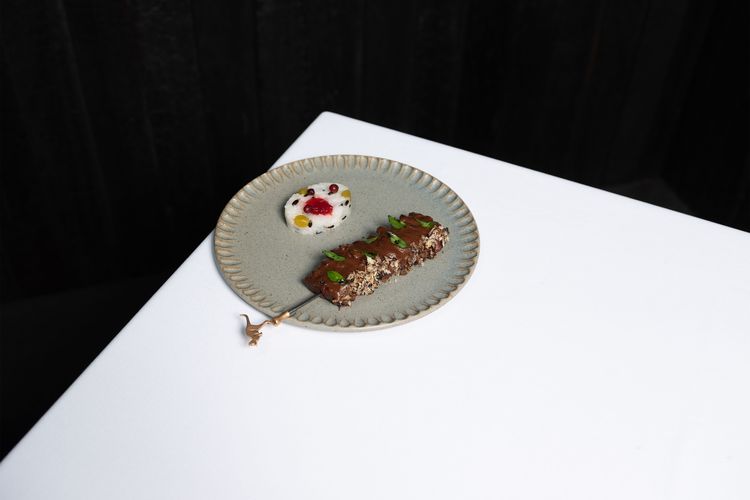 Roo Satay, a dish at Attica, in Melbourne, featuring a skewer of grilled red kangaroo and rice studded with native fruits and wattleseeds, which were traditionally ground into flour for bread.