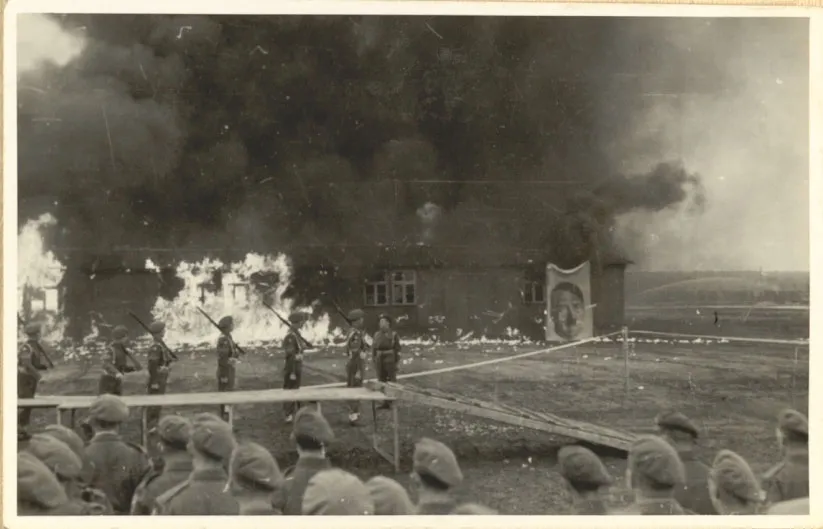 British forces ceremonially burn barracks in Bergen-Belsen in 1945.