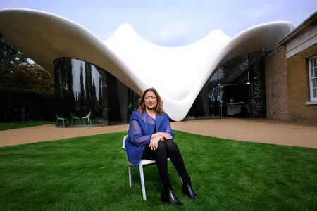 The late Zaha Hadid sits in front of one of her structures, the Serpentine Sackler Gallery in London.