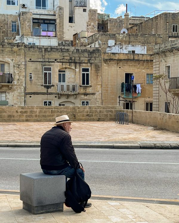 An elderly citizen waiting for a bus in Valletta thumbnail