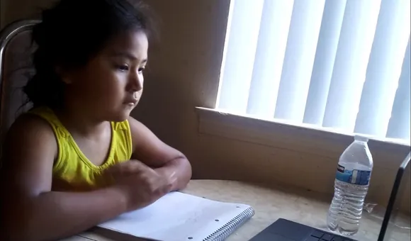 A Diné child begins her much-anticipated school year online in Albuquerque, New Mexico. (Courtesy of Cornillia Sandoval, used with permission)