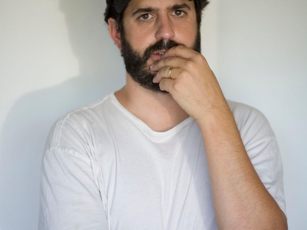 Photograph of Alec Soth taken in his studio