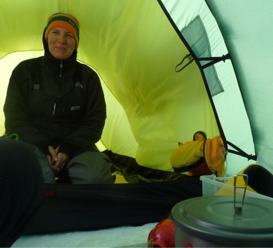 The cozy inside of Aston’s tent, with dinner cooking in the foreground.