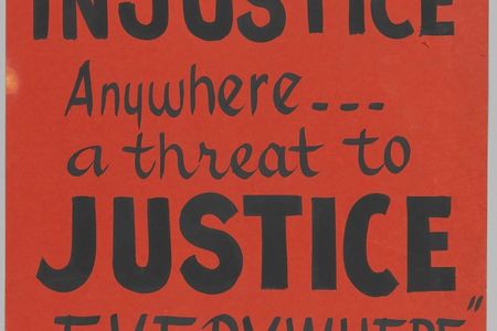 A black ink on a red-orange poster board with a small picture of Martin Luther King, Jr. at the top left and Joseph Lowery at the top right. The poster reads: [SCLC / INJUSTICE / Anywhere... / a threat to / JUSTICE / EVERYWHERE / M. L. KING].