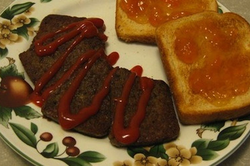 Snowpocalypse scrapple with ketchup, served with a side of toast.