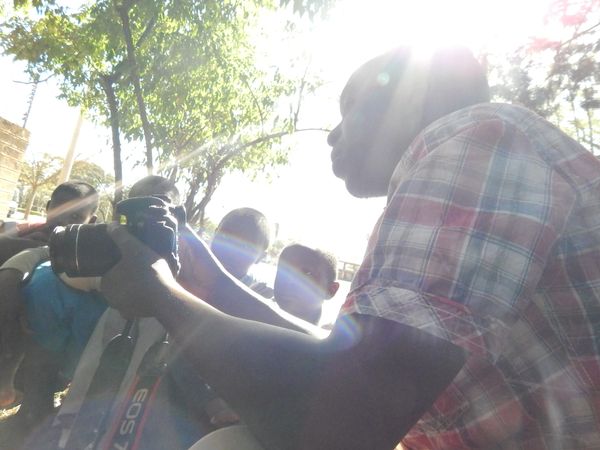 A photojournalist shares his skills with children in Nairobi, Kenya. thumbnail