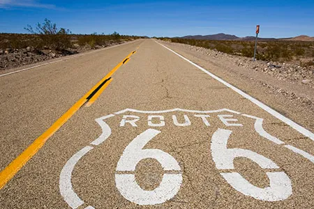 The 2,400-mile-highway "took us to places that we needed to be, not in a literal sense, but a more philosophical sense," says curator Roger White.
