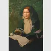 Julia Ward Howe posed seated with a book open on her lap.