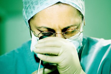 A surgeon using an endoscope, similar to the device involved in the UCLA outbreak