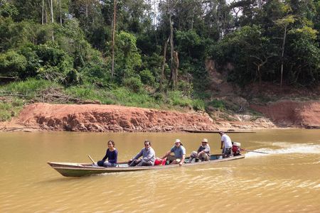 Paleontologists crossing the Rio Yurúa in Amazonian Perú, with the Santa Rosa fossil site in the background.