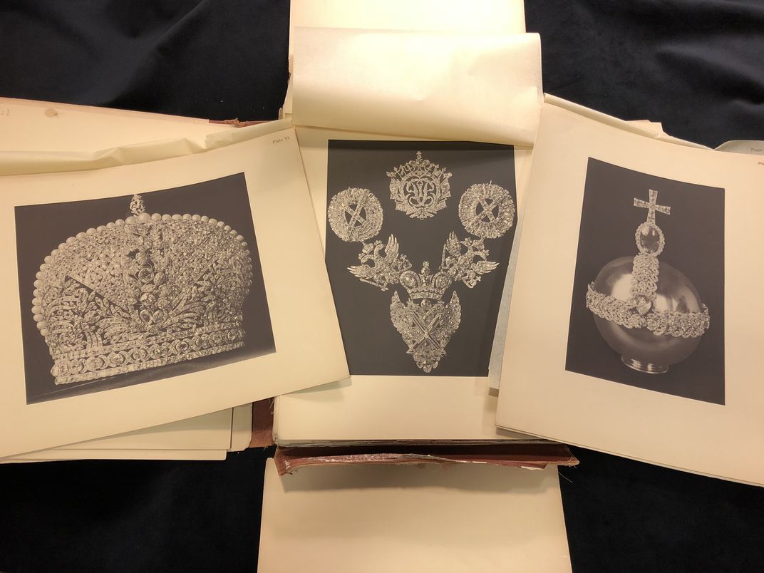 Early 20th century book with loose photographic plates. Plates illustrate three sets of jewels.