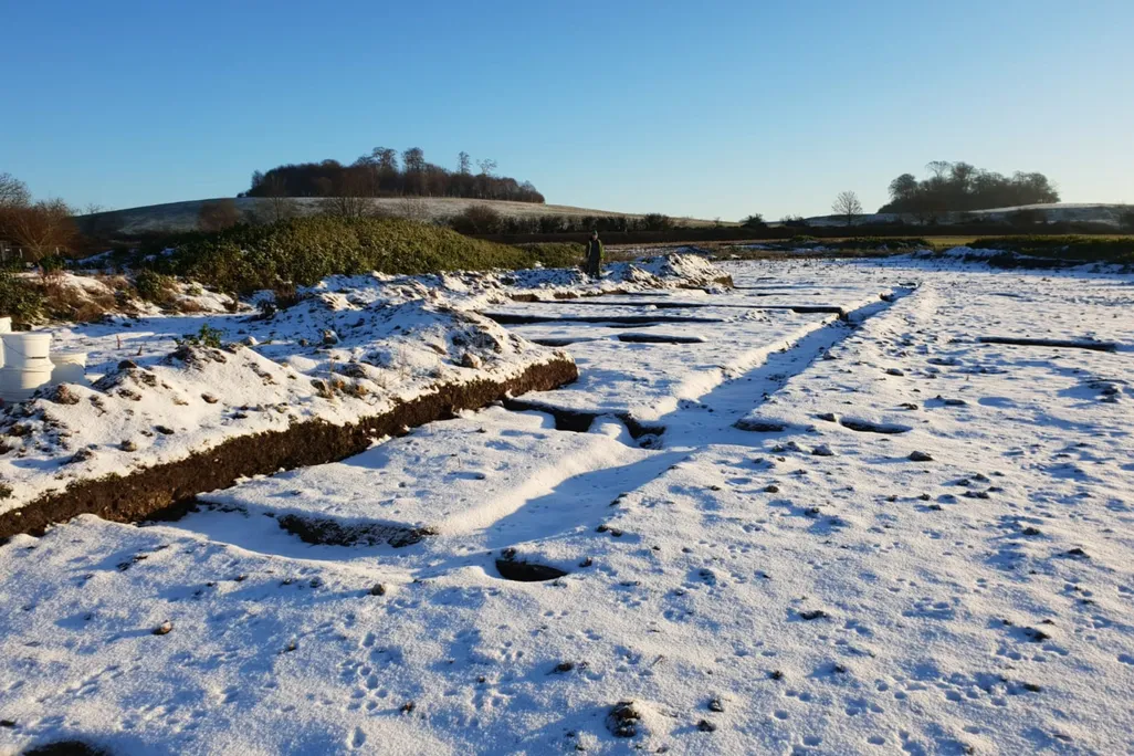Snow-covered outline of the Roman villa's foundations