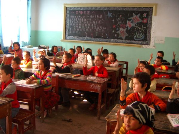 Uighur students all know the answer in Amangul Kader's English class at a poor school in Kashgar, Xinjiang, China. thumbnail