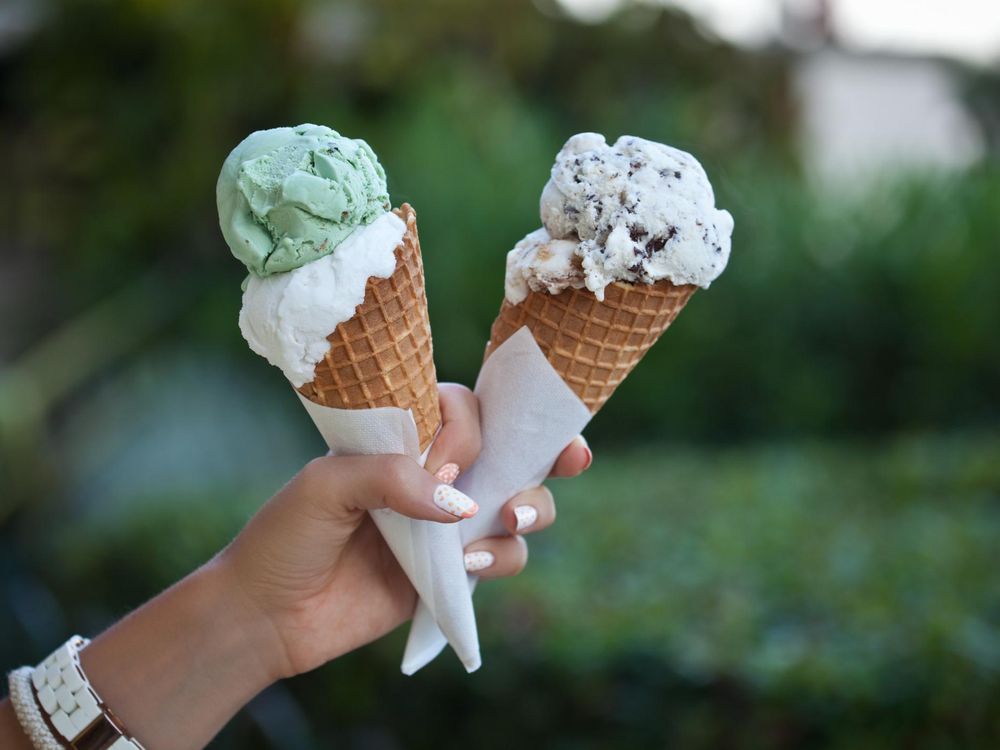 Hand holding an ice cream cones