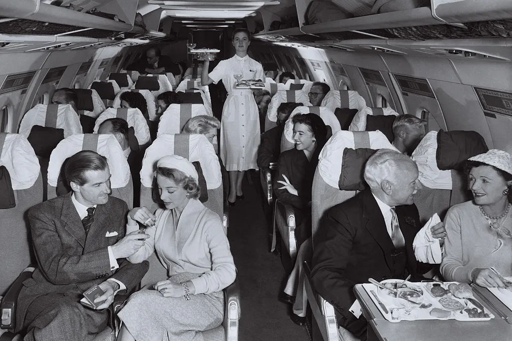passengers onboard a plane in the 1950s