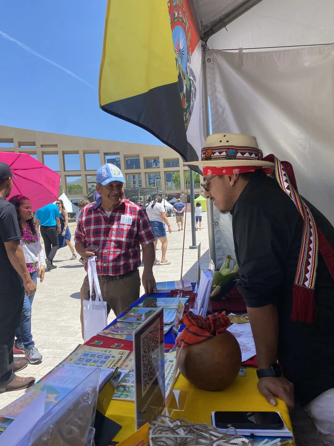 Gaspar Tomas, a Q’anjob’al speaker and MLPP advisory board member, chats with members of Salt Lake City's community at the 2024 Living Traditions Festival.