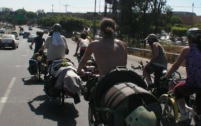 The Ginger Ninjas on the move in Guadalajara, Mexico. Where buses and airplanes would provide the horsepower for other touring bands, the Ginger Ninjas go by bicycle.