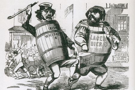 Anti-immigrant cartoon showing two men labeled "Irish Wiskey" and "Lager Bier," carrying a ballot box. 