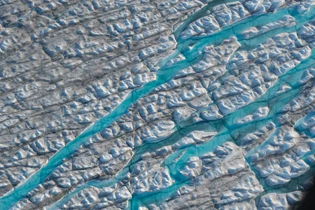 An aerial view of meltwater rivers carving into the Greenland ice sheet on August 04, 2019.