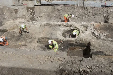 Archaeologists excavate the outside areas of the Theater. 