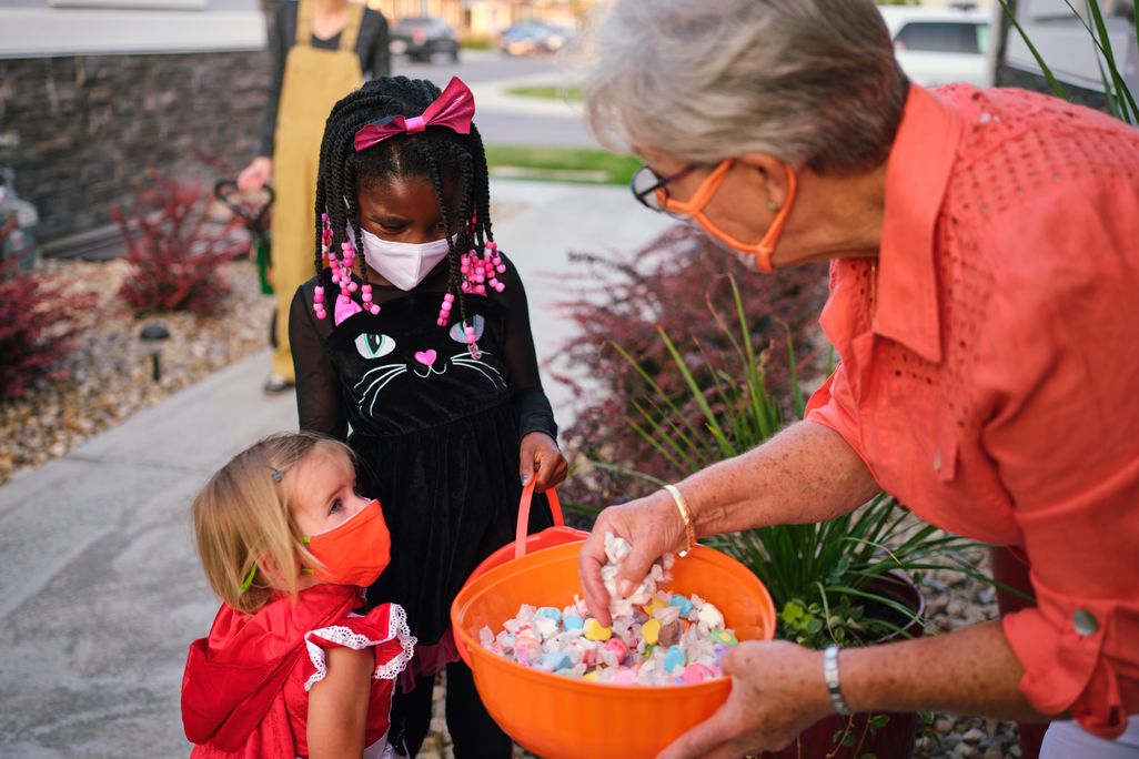 Kids trick or treating with masks on