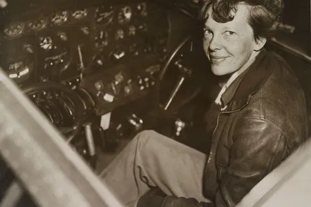Amelia Earhart sitting in her cockpit