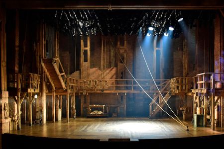 David Korins' striking design—involving a double turntable, a second level catwalk, scaffolding and ropes, calls to mind the ships that brought the Founding Fathers to America.