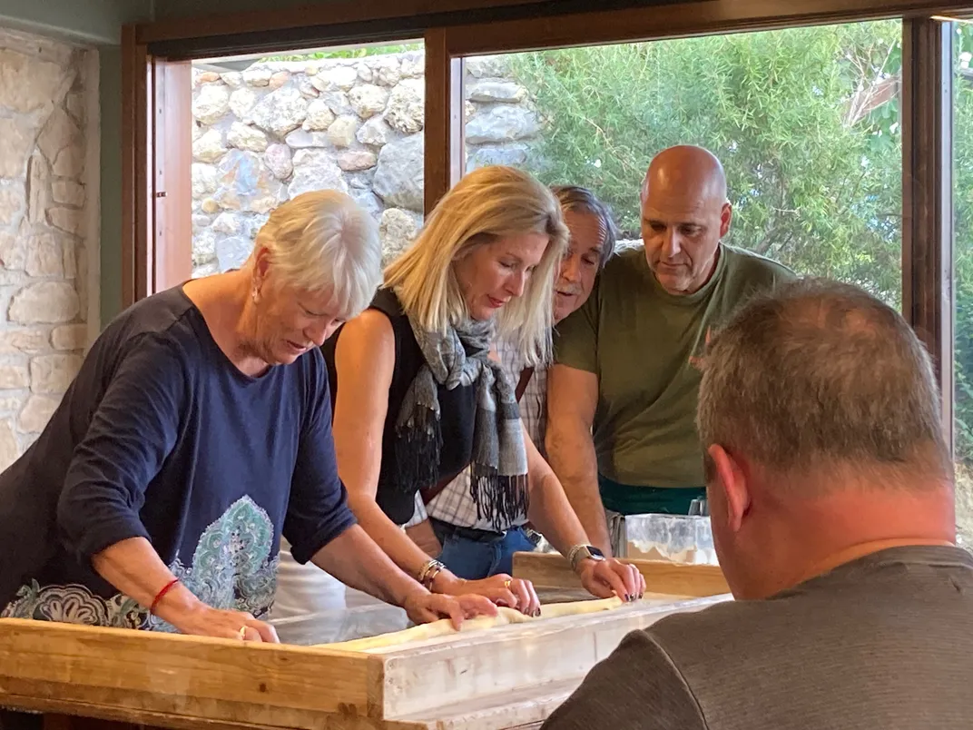 Trying their hands at making pasta. Credit: Ashley Elston