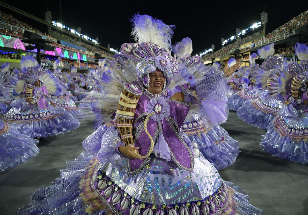Portela samba school performers display their lively costumes during the Carnival parade.