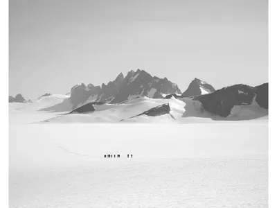 OPENER - A team skis from the remote Taku D site to the Camp 10 sleeping quarters. Students often travel as much as 8 to 10 miles a day, carrying packs a third of their body weight.