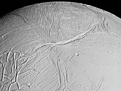A mosaic of Enceladus collected by Cassini showing deep fissures or sulci