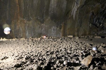 A trio of “Pit-bots” explore a lunar cave.