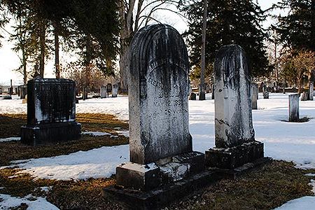 The region's legacy of acid rain is clearly visible in the black crust on the gravestones at the Madison Street Cemetery in Hamilton, New York.