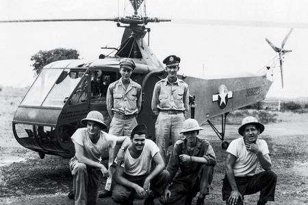In eastern India in 1944, Carter Harman (standing, left, next to his co-pilot) had the extremely rare job of helicopter pilot.The maintainers with him, members of the 1st Air Commando group, were among the first to service helicopters in the field.