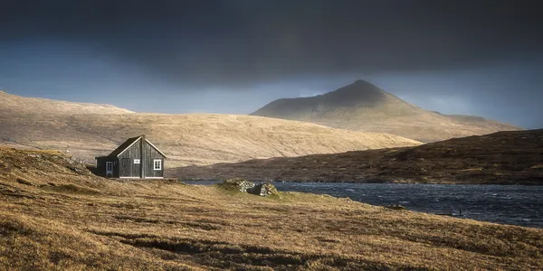 On my my latest Faroe trip, I attempted to fly a drone over the cliff. I sent the aircraft into the Ocean, looking for some good perspective on the cliff, but western wind pushed it over the lake. I completely lost control over the drone which ended up in airport no flight zone. Safety features in aircraft made it to land on the lake. I thought it’s gone but last minute, I managed to regain control over device and moved it towards shore, except it was the other side of the lake. In order to get my drone back, I had to cross the river, coming out the lake and falling into the Ocean 80 meters further. Normally that river is narrow and shallow but it was raining a lot, so this time water was much deeper. I got in a bit of trouble, half way trough, where it was deepest and current strongest.  I expanded my tripod legs and helped myself keep the balance. Thank God I made it. I got my drone back but I was absolutely soaked. Not wanting to risk again, I decided to walk back on the other side of the lake, which was additional 7km.