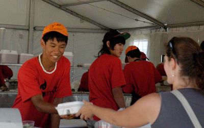 A visitor samples southeast Asian food at the 2011 Smithsonian Folklife Festival