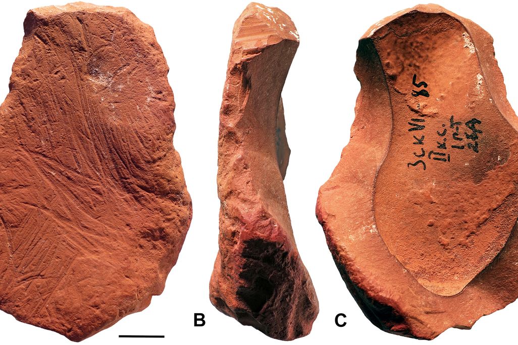 front side and back views of a piece of ochre