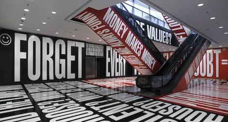 The artist’s black, white and red phrases titled Belief+Doubt exist outside the traditional galleries.