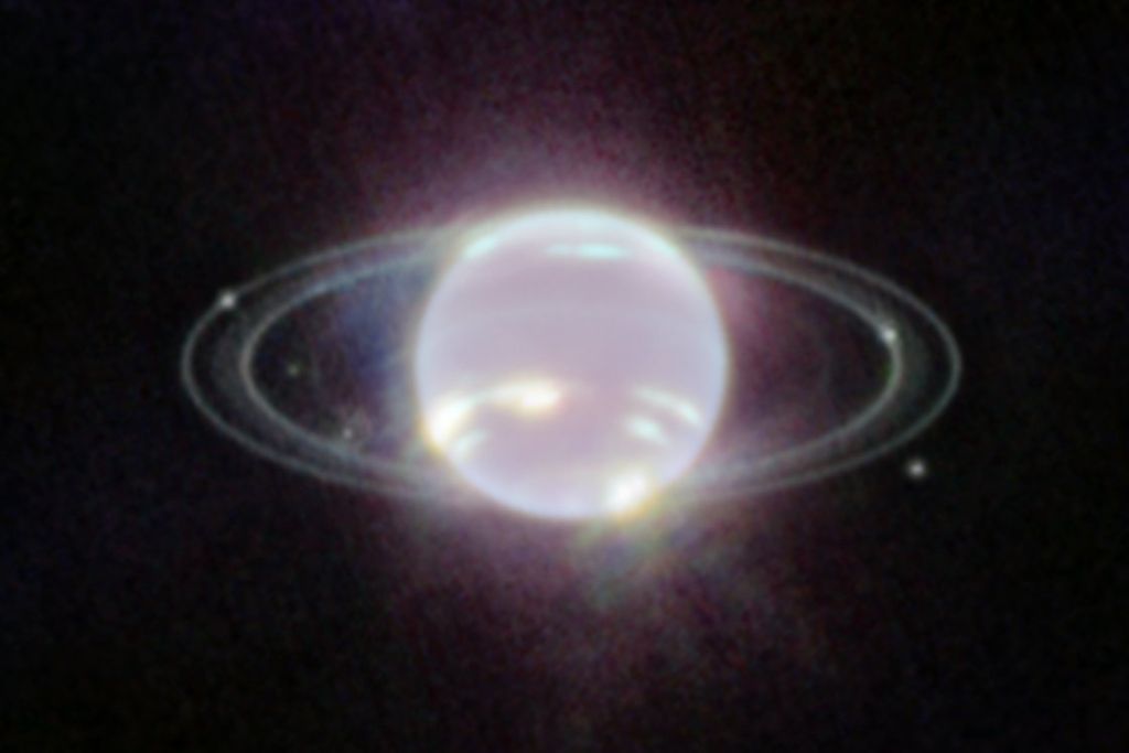 Neptune surrounded by its rings and seven of its moons