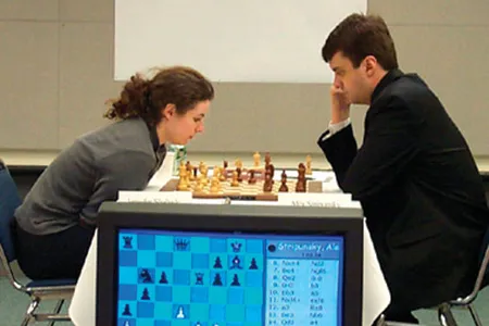 At the 2002 U.S. Chess Championship, the first in which men and women competed together, Shahade (left, losing to Alexander Stripunsky) took the women's title.