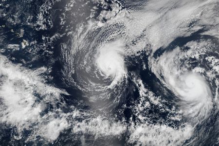 A NASA satellite image shows Hurricane Iselle approaching Hawaii, with Hurricane Julio hot on its heels.