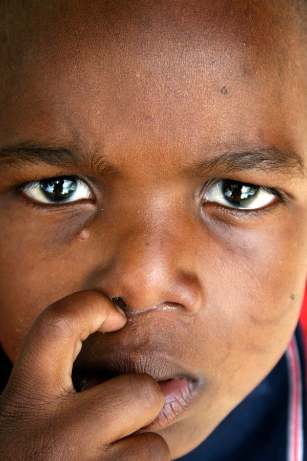 Young Zulu boy, outside his classroom. thumbnail