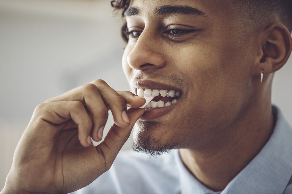 A man chews gum